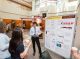 An undergraduate presents his poster on brown tissue innervation in resistance to stress-induced obesity