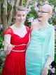 Two girls oin prom dresses smiling