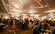Dining tables fill the 2024 St. Jude Angels for Hope Gala ballroom, lit with chandeliers. 