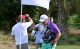 Golfers high-five at the 2024 Rahm Celebrity Golf Tournament. 